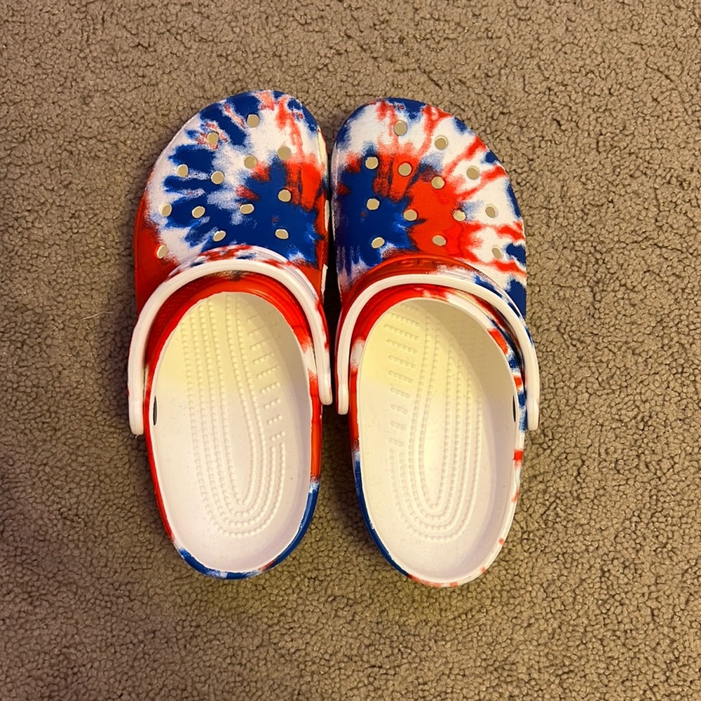 RED, WHITE, AND BLUE TIE DYE CROCS